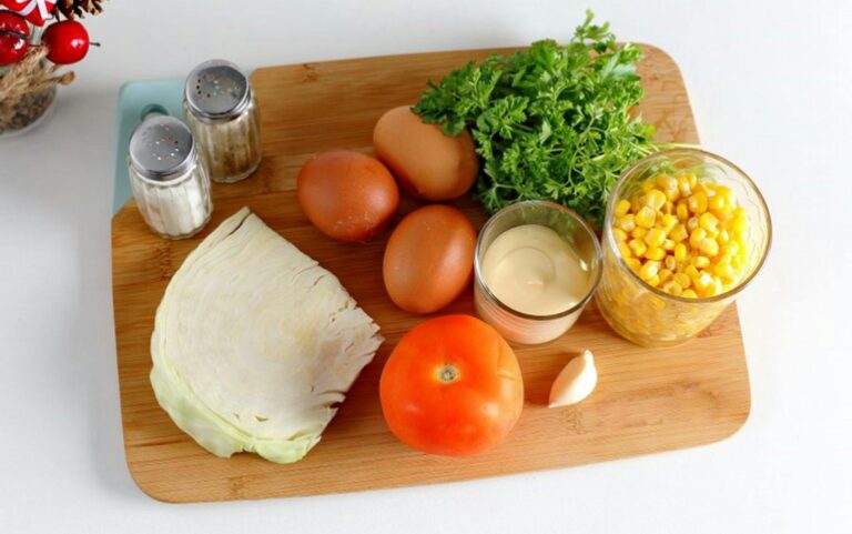 Close-up view of eggs, vegetables, and spices on a wooden cutting board, perfect for cooking inspiration.